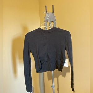 Forever 21 form fitting black long sleeve crop top. Size medium. New with tags